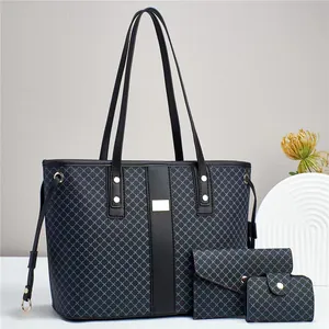 Three-piece set detail with tote bag and pouches featuring blue geometric lattice patterns