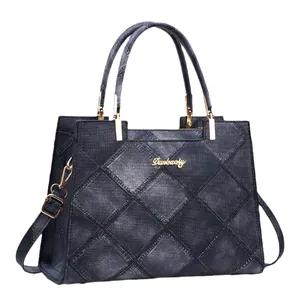 Retro deep blue denim tote bag with quilted diamond patterns and golden hardware