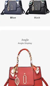 Close-up of textured faux leather handbags with silk scarf handle and metal leaf charms