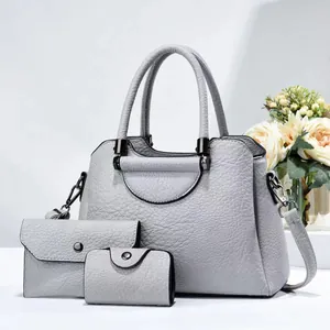 Three-piece light grey handbag set including purse and key holder with pebble texture