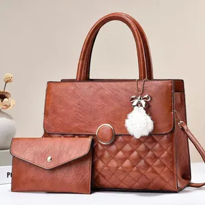 Retro brown quilted faux leather handbag set with plush pompom and gold metal accents