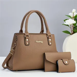 Three-piece brown pebble grain leather handbag set with logo and adjustable strap