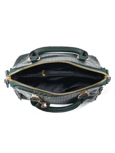 Deep green crocodile embossed handbag featuring multiple internal compartments and golden zipper