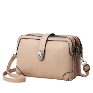 Elegant apricot lychee textured PU leather crossbody bag with triple zipper layers