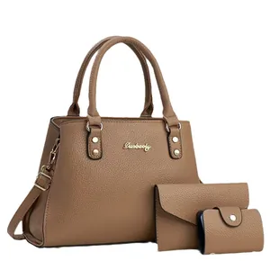 Three-piece brown pebble leather handbag set with tote bag, pouch, and card holder