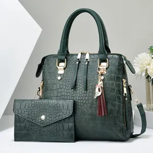 Women's 2-piece dark green handbag set with crocodile pattern and tassel detail