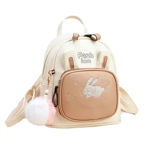 Cute mini leather backpack for women with bunny ears and fuzzy pom pom charm