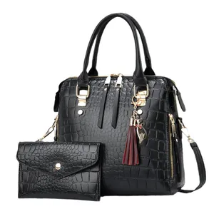 Black crocodile embossed tote bag set with matching wallet and golden hardware