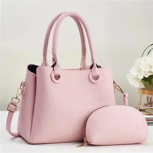 Pink minimalist leather tote bag set with matching pouch and adjustable shoulder strap