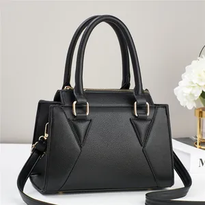 Classic black lychee pattern tote bag with gold hardware and adjustable strap