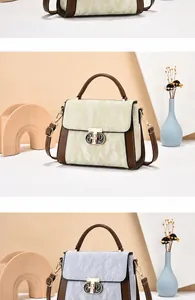 Detail van trendy kleurblok crossbodytas met rimpeltextuur en metalen draaisluiting