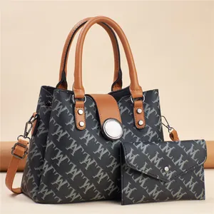 Elegant grey patterned tote bag with matching wallet and brown synthetic leather handles