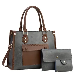 Dreiteiliges Shopper-Set aus grauem strukturiertem Leder mit braunen Griffen und Gurt