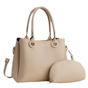 Minimalist beige pebble leather tote bag set with matching small zipper pouch