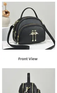 Vue de face du sac rond noir en similicuir avec fermetures dorées et pendentif perle