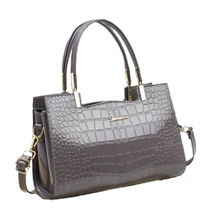 Glossy purple crocodile embossed tote bag with gold hardware and top handles