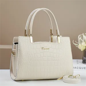 Beige faux crocodile leather tote bag with gold logo and detachable shoulder strap