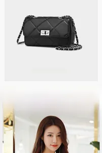 Detail of black quilted leather shoulder bag featuring a metal twist lock and chain strap