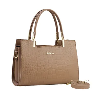 Brown faux crocodile embossed tote bag with gold hardware and detachable shoulder strap