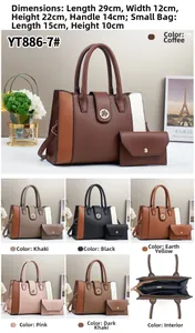 Detail view of large contrast-color handbag with dimensions 29x12x22cm and matching mini pouch