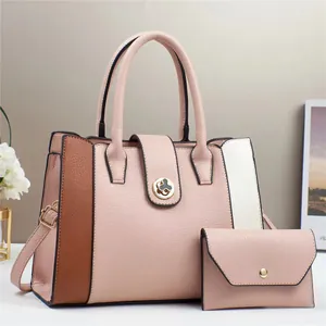 Detailed macro view of pink colorblock tote bag set with matching zip wallet