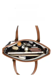 Top view showing the large capacity interior of striped tote bag with personal items