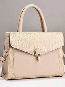 Beige tote bag with crocodile texture and gold ring lock shown in a front-facing studio view