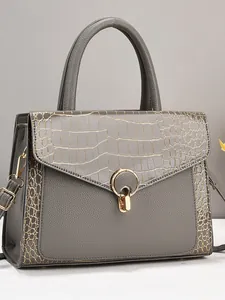 Deep grey crocodile texture tote bag with golden hardware and adjustable shoulder strap