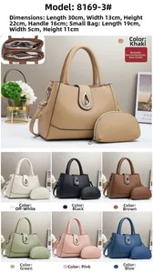 Detailed view of the luxury lychee grain leather handbag set with metal twist lock closure
