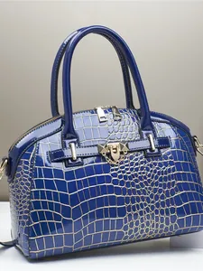 Blue crocodile pattern patent leather handbag with gold hardware and top handles