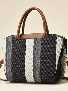 Women's large canvas tote bag with black and white stripes and brown leather handles