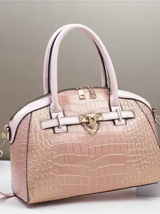 Pink crocodile-embossed satchel handbag with gold hardware and top handle for women