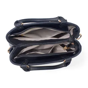 Interior view of black tote bag showing spacious double compartments and textured lining