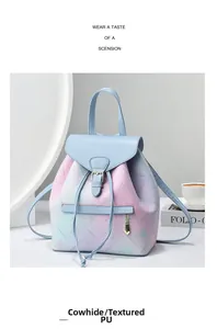 Detail of gradient blue to pink textured PU leather backpack with delicate star prints