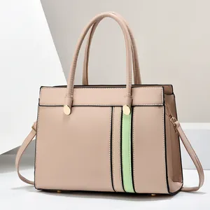 Detail view of structured beige tote bag with light green leather vertical stripes and hardware