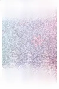 Detail of soft gradient faux leather with embossed star patterns on school backpack