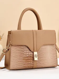 Brown patchwork tote bag with crocodile and ostrich textures featuring a gold metal lock
