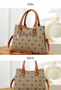 Detail view of the monogram printed tote bag showing the back zipper pocket and side profile