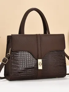 Dark brown tote bag with crocodile pattern and golden twist lock for women