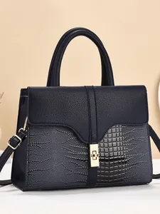 Dark blue tote bag with crocodile and lychee leather textures and golden twist lock
