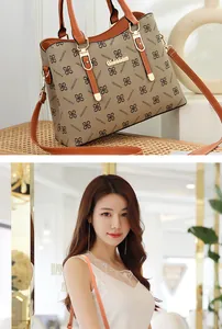 Detail of contrast-color tote bag with floral monogram print and premium metal logo