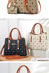 Detail of large printed tote bags and matching wallets in black, cream, and brown leather