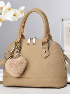 Fashion apricot shell handbag in lychee texture leather with heart plush pendant charm