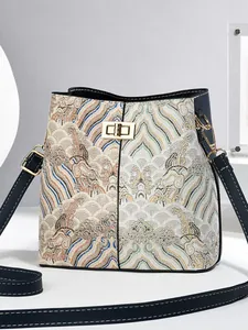 Retro Chinese style bucket bag with floral embroidery and blue leather stitching