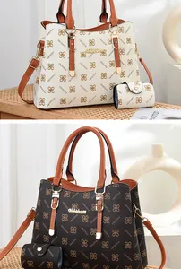 Detail view of large capacity printed tote bag set with metal brand logo and floral patterns