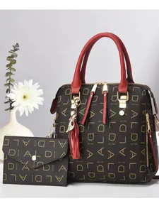 Brown printed tote bag and wallet set with bold red handles and stylish tassel detail