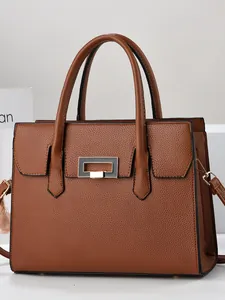 Classic cognac pebbled leather tote bag with elegant rectangular gold lock and top handles