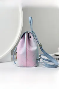 Detailed view of the gradient floral print and premium PU leather texture on the backpack