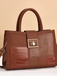 Brown faux leather tote bag with crocodile texture and golden metal lock for women