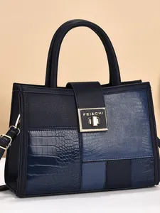 Contrast navy blue tote bag with crocodile pattern and golden clasp for women